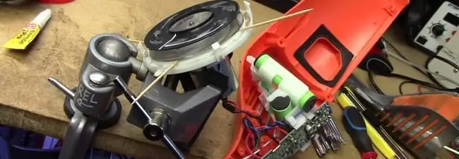 Vacuum cleaner repair parts and tools on a workbench in Saint Petersburg, FL