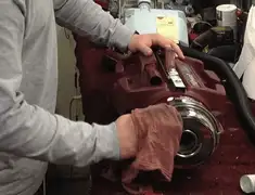 Vacuum repair technician cleaning and servicing a vacuum motor in Saint Petersburg, FL